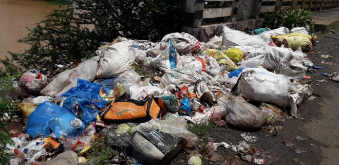Garbage on river bench Garbage on river bench